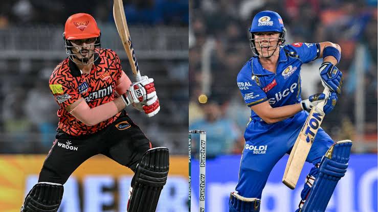 Cricketers from two teams batting in a match