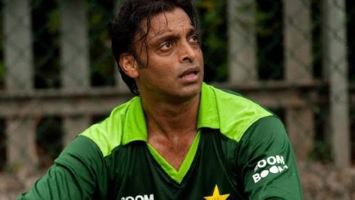 Focused cricket player in green jersey